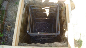 rebar cage installed in hole for concrete antenna base.