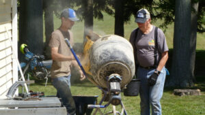 N8RNK and KE8LVA mixing concrete