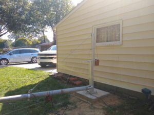 Tilt over antenna tower mounted on new concrete footer.