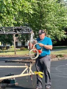 Eric, W8ELM, preparing antenna tower guy wires for 2021 ARRL field day